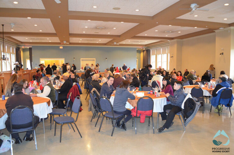 Hall shot of staff, volunteers, and attendees