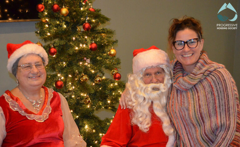 Mr & Mrs Claus with person