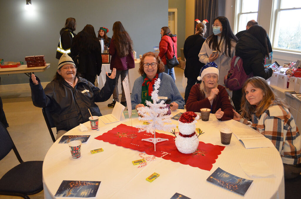 PHS 2023 Mental Health Christmas Party. Hall shot of staff, volunteers, and attendees